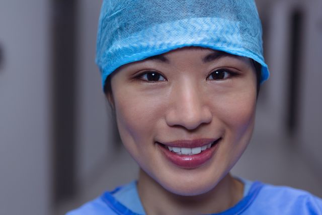 Happy female surgeon looking at camera at hospital - Download Free Stock Photos Pikwizard.com