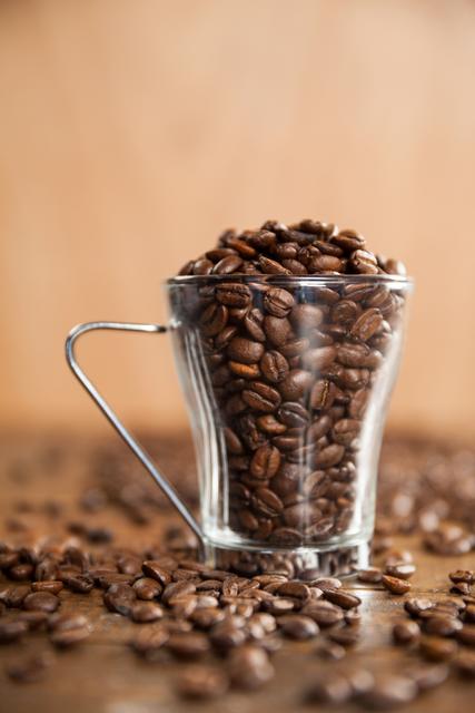 Transparent glass cup filled with coffee beans - Download Free Stock Photos Pikwizard.com