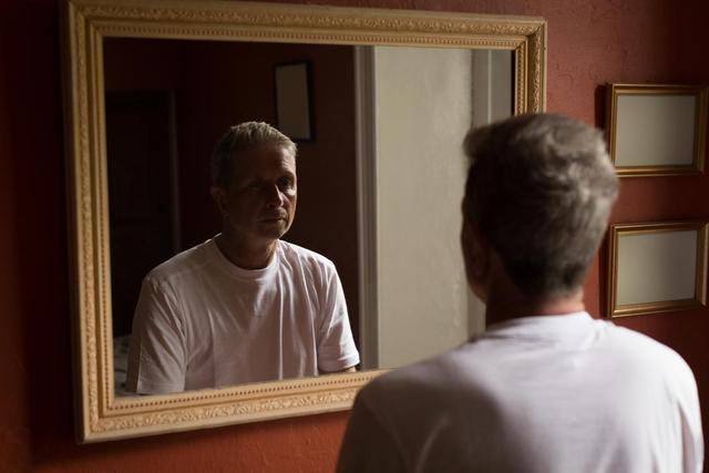 Senior man looking at mirror in bathroom - Download Free Stock Photos Pikwizard.com