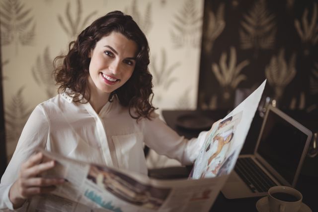 Beautiful woman reading newspaper in restaurant - Download Free Stock Photos Pikwizard.com