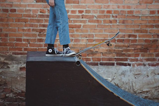 a person standing on a skateboard - Download Free Stock Photos Pikwizard.com