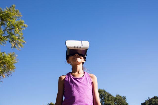 Girl using vr headset in the park - Download Free Stock Photos Pikwizard.com