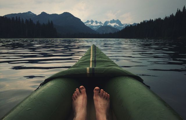 a person's feet in a canoe - Download Free Stock Photos Pikwizard.com