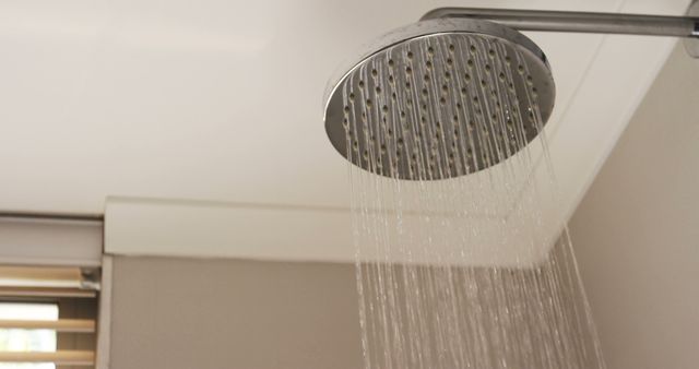 Close-up of shower head with flowing water in bathroom at home 4k - Download Free Stock Photos Pikwizard.com