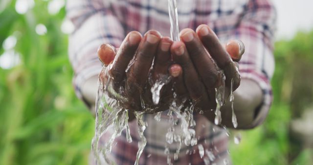 Midsection of african american man washing hands in garden after gardening - Download Free Stock Photos Pikwizard.com