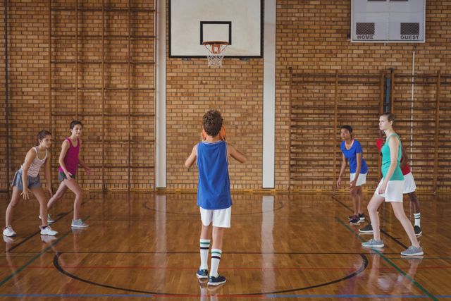 High school boy about to take a penalty shot while playing basketball - Download Free Stock Photos Pikwizard.com