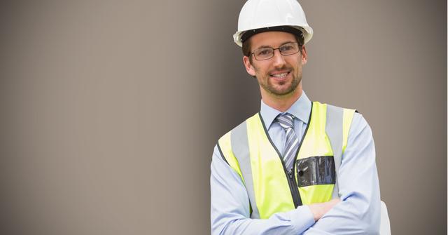 Portrait of male engineer standing with arms crossed - Download Free Stock Photos Pikwizard.com