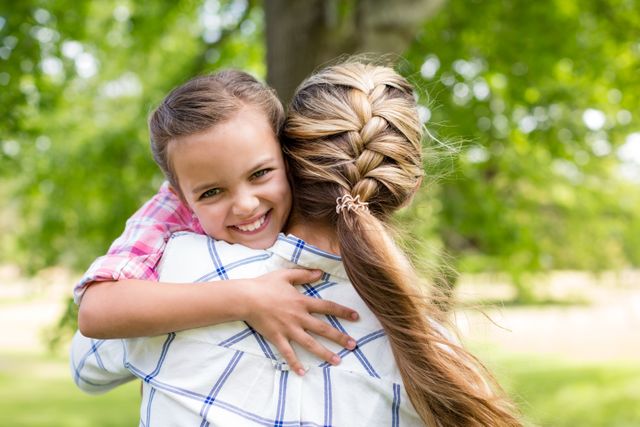 Girl embracing her mother in park - Download Free Stock Photos Pikwizard.com