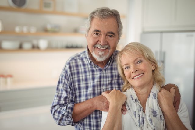 Senior couple hugging each other at home - Download Free Stock Photos Pikwizard.com