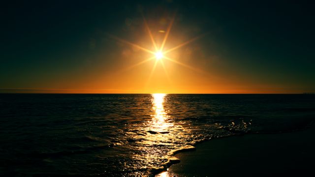 the sun setting over the ocean - Download Free Stock Photos Pikwizard.com
