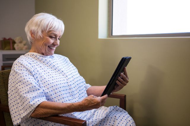 Senior patient using digital tablet to video chat - Download Free Stock Photos Pikwizard.com