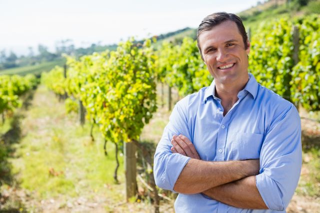Portrait of smiling vintner standing with arms crossed - Download Free Stock Photos Pikwizard.com