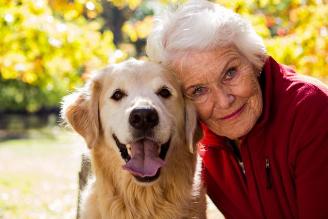 Portrait of elderly woman sitting with dog - Download Free Stock Photos Pikwizard.com