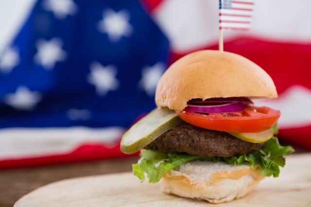 Burger on wooden table with 4th july theme - Download Free Stock Photos Pikwizard.com