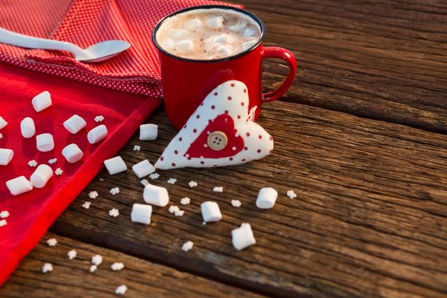Coffee with sugar cube, napkin and heart on wooden plank - Download Free Stock Photos Pikwizard.com