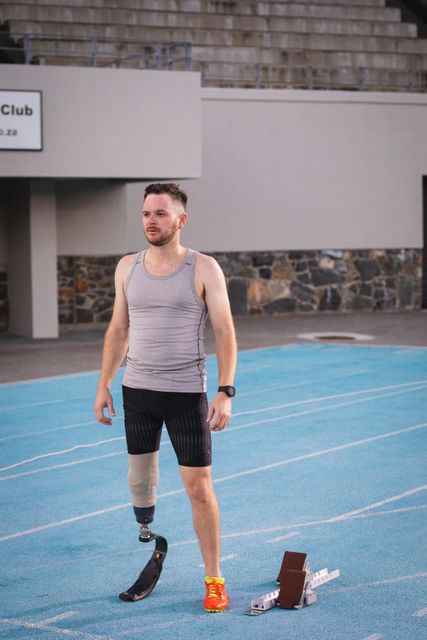 Caucasian disabled male athlete with prosthetic leg training, standing on runway - Download Free Stock Photos Pikwizard.com