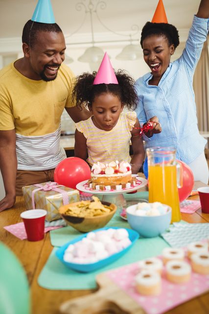 Happy family celebrating a birthday - Download Free Stock Photos Pikwizard.com