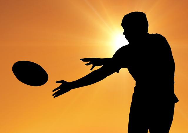 Silhouette of a man catching rugby ball - Download Free Stock Photos Pikwizard.com