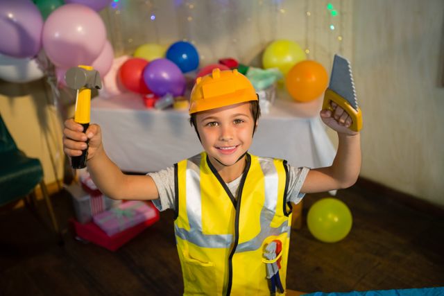 Boy pretending as a worker during birthday party - Download Free Stock Photos Pikwizard.com