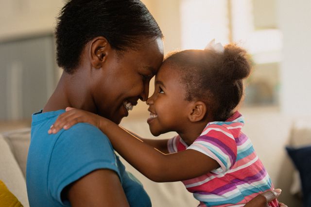 Portrait of happy african american mother and daughter hugging - Download Free Stock Photos Pikwizard.com