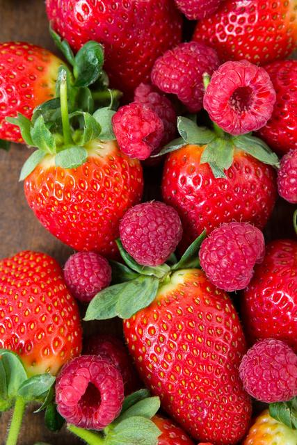 Fresh strawberries and raspberries - Download Free Stock Photos Pikwizard.com