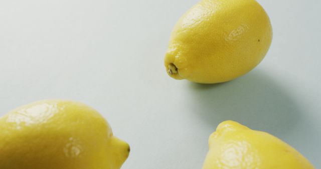 Image of fresh lemons lying on grey background - Download Free Stock Photos Pikwizard.com