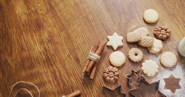 Image of christmas decorations with cookies and copy space on wooden background. christmas, tradition and celebration concept.
