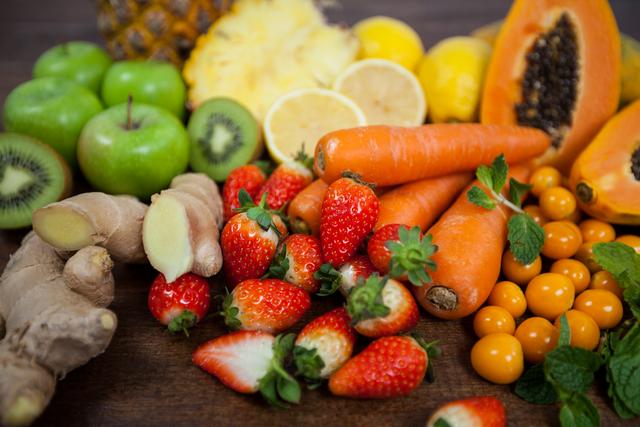 Close-up of various fresh vegetables and fruit on table - diet concept