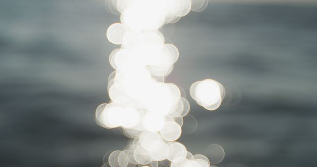 Bokeh sunlight reflected on ripples of calm ocean - Download Free Stock Photos Pikwizard.com