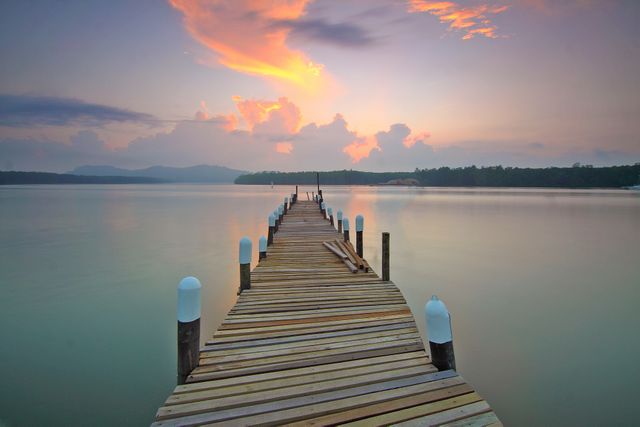 Brown Wooden Footbridge on Body of Water during Sunrise - Download Free Stock Photos Pikwizard.com
