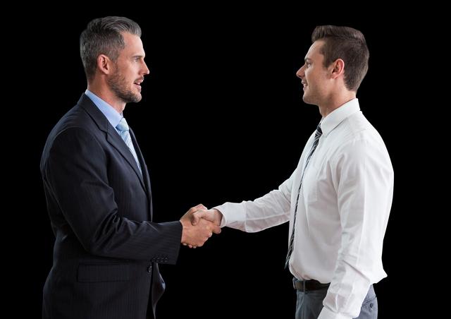 Business men shaking hands against black background - Download Free Stock Photos Pikwizard.com