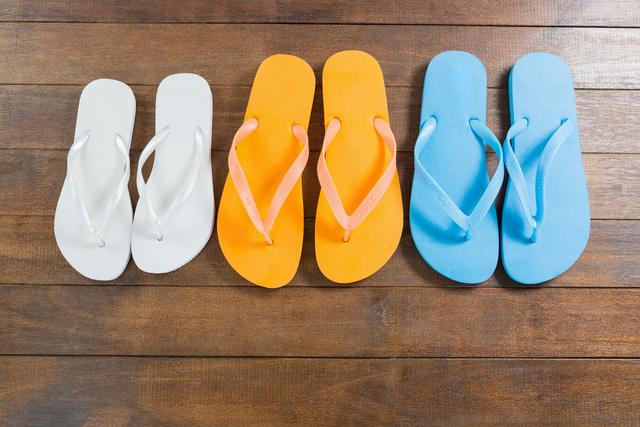 Three pair of beach flip flop slippers - Download Free Stock Photos Pikwizard.com