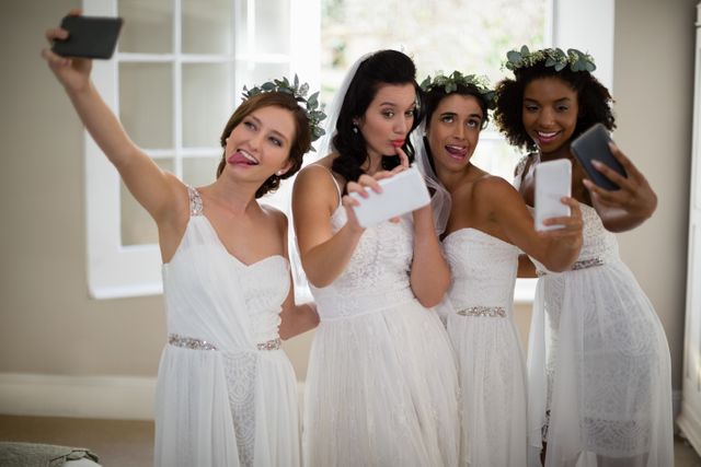 Bride and bridesmaid taking selfie at home - Download Free Stock Photos Pikwizard.com
