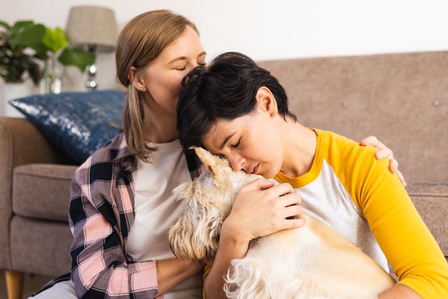 Caucasian loving mid adult lesbian woman kissing on girlfriend's head embracing scottish terrier - Download Free Stock Photos Pikwizard.com