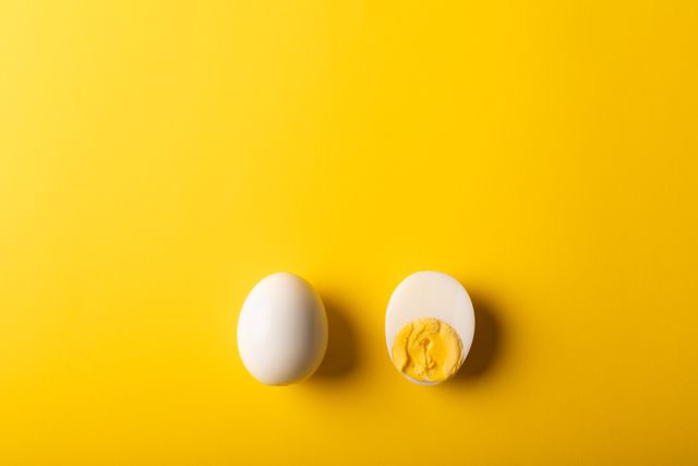 Overhead view of boiled eggs on yellow background, copy space - Download Free Stock Photos Pikwizard.com