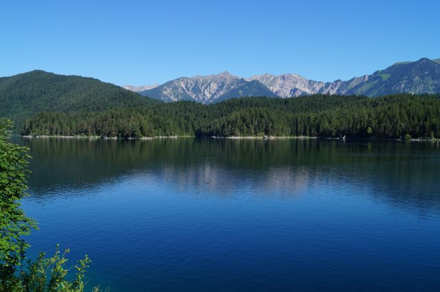 Scenic View of Lake and Mountains Against Clear Blue Sky - Download Free Stock Photos Pikwizard.com