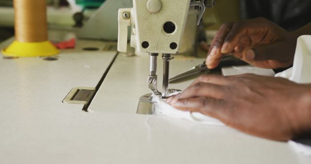 Hands of african american male tailor using sewing machine in workshop - Download Free Stock Photos Pikwizard.com