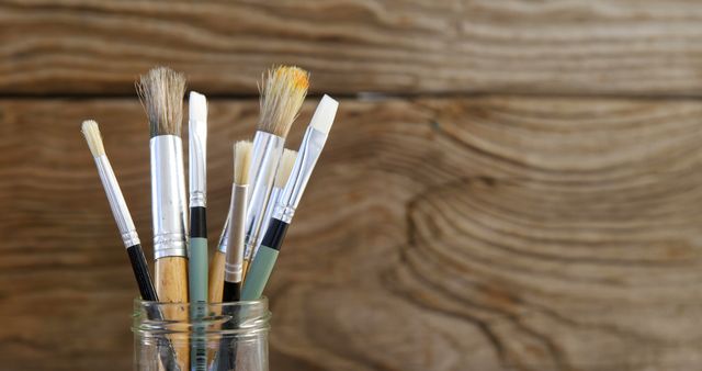 Artist Paint Brushes on the Wooden Background Stock Image - Image