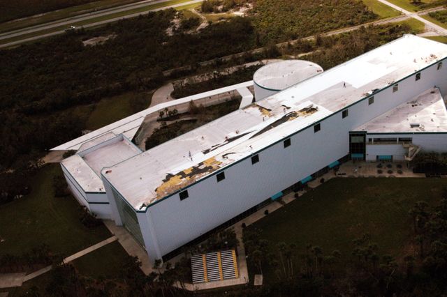 KENNEDY SPACE CENTER, FLA. - In this aerial view, damage is apparent on the roof of the Apollo/Saturn V Building at KSC from Hurricane Jeanne.  A category 3 storm, Jeanne barreled through Central Florida Sept. 25-26,  the fourth hurricane in 6 weeks to batter the state.