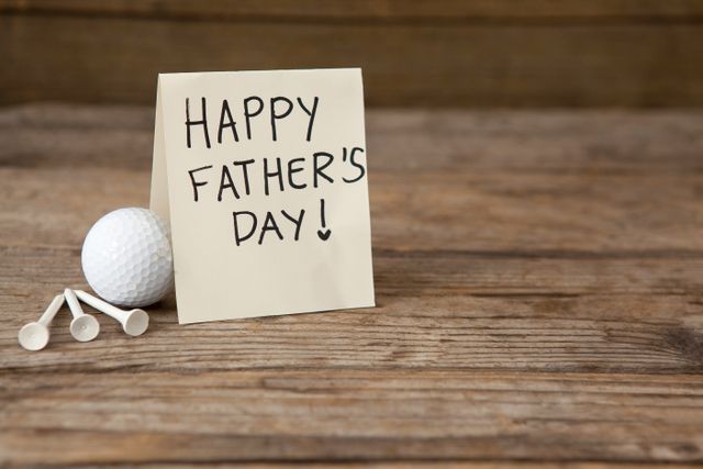 Fathers day greeting card by golf ball on table - Download Free Stock Photos Pikwizard.com