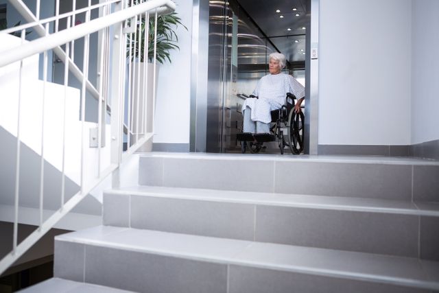 Disabled senior patient on wheelchair in lift - Download Free Stock Photos Pikwizard.com