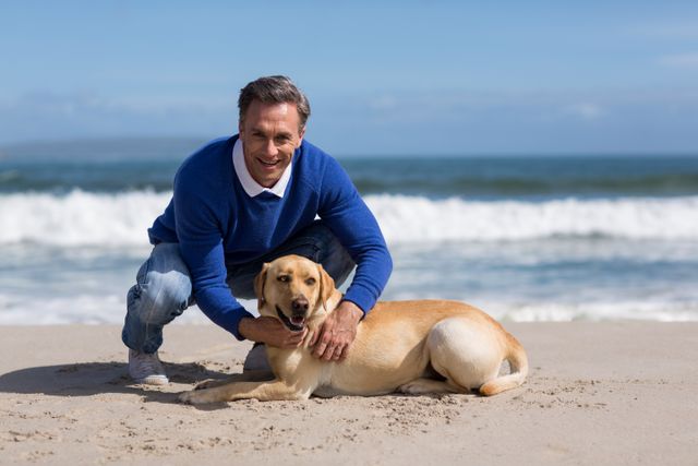 Mature man with his dog on the beach - Download Free Stock Photos Pikwizard.com