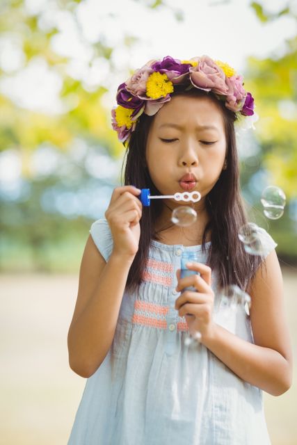 Girl blowing bubble wand - Download Free Stock Photos Pikwizard.com