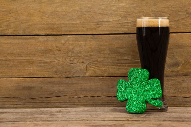 Glass of black beer and shamrock for St Patricks Day - Download Free Stock Photos Pikwizard.com