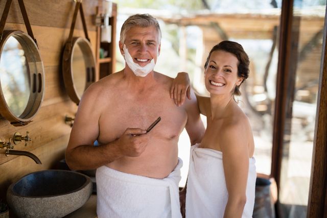 Portrait of couple smiling while shaving in cottage - Download Free Stock Photos Pikwizard.com