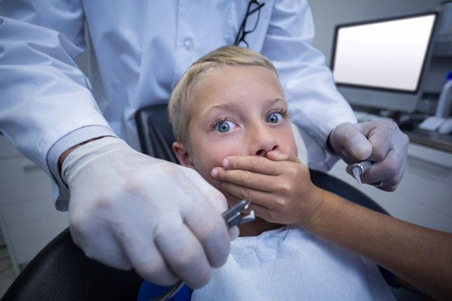 Young patient scared during a dental check-up - Download Free Stock Photos Pikwizard.com