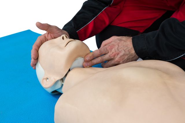 Paramedic practicing resuscitation on dummy - Download Free Stock Photos Pikwizard.com