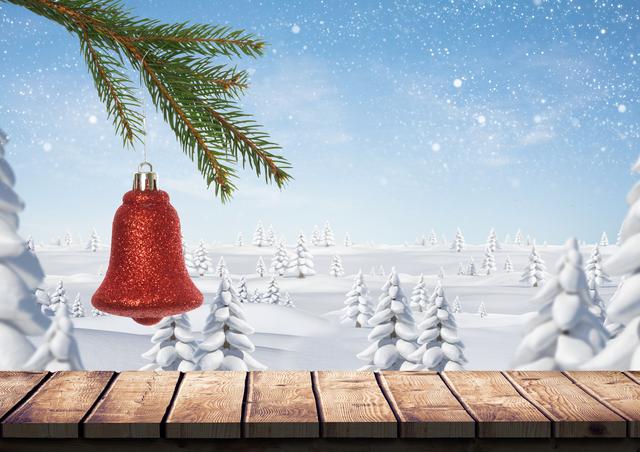 Christmas bell hanging on branch of fir tree over wooden plank with snow covered trees in background - Download Free Stock Photos Pikwizard.com