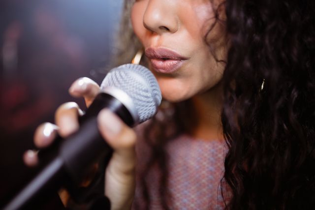 Close up of female singer singing at nightclub - Download Free Stock Photos Pikwizard.com