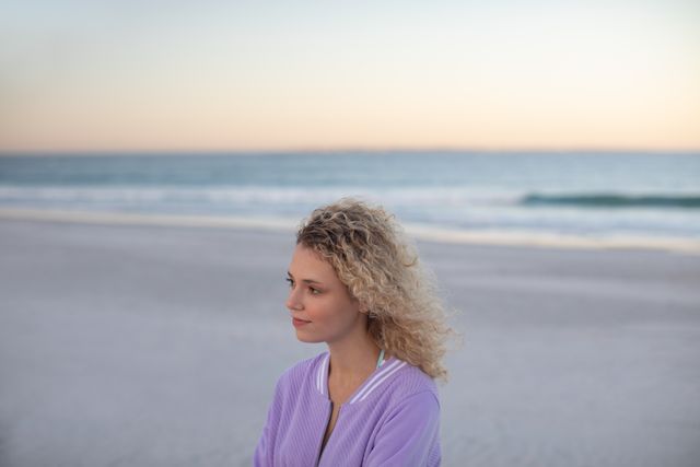 Beautiful woman standing on the beach  - Download Free Stock Photos Pikwizard.com